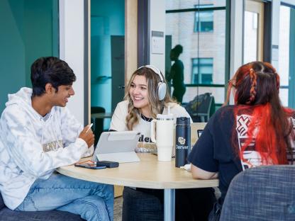 Three CU Denver online students in a project meeting