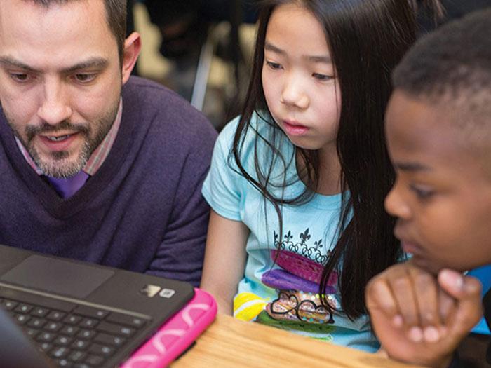 CU Denver digital education student working with kids