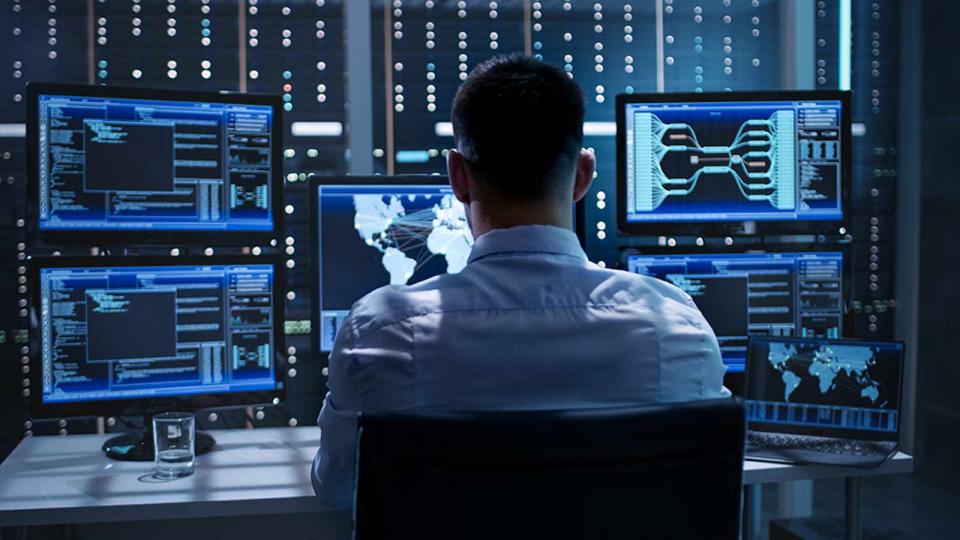 CU Denver graduate working on the cybersecurity of an organization